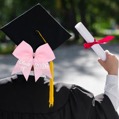 Knitgrip bow attached to a mortarboard cap highlighting visible graduation accent