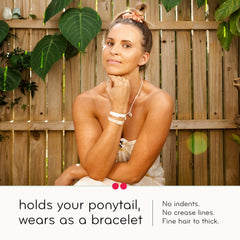 KOOSHOO worn as bracelet on wrist useful as fashion and quick-access holder