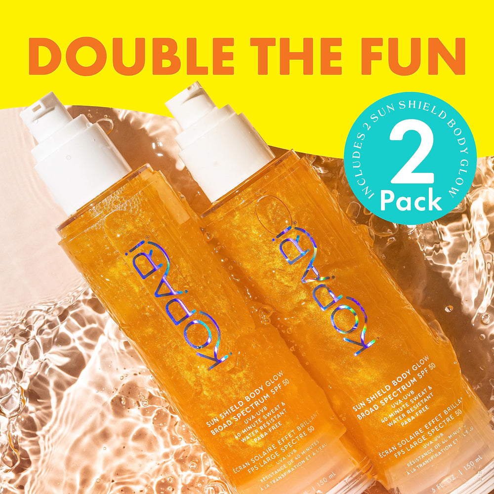 Kopari tube beside hand for scale showing portable two-pack convenience