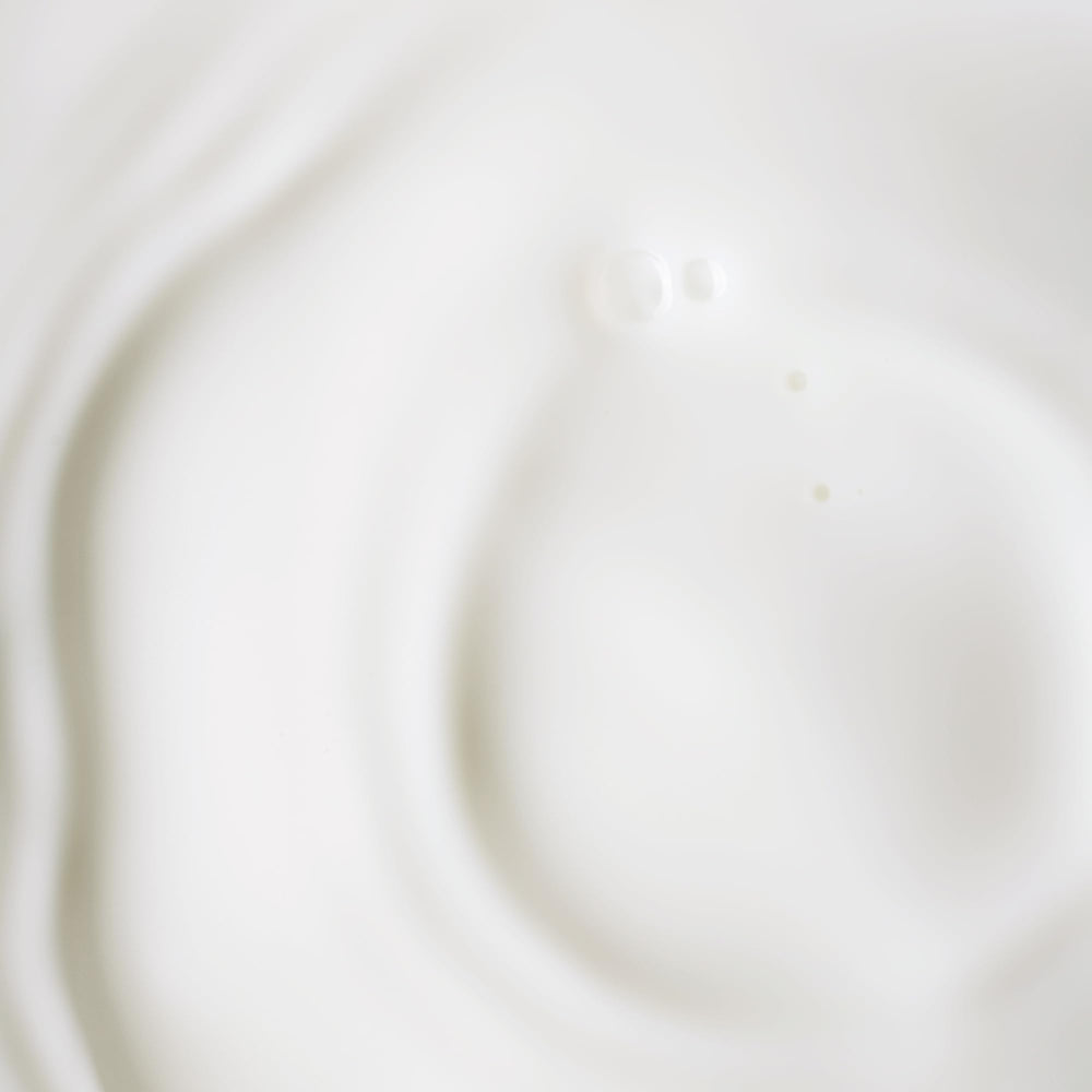 KORA Organics bottle next to a coin for visible size comparison
