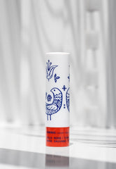 KORRES Wild Rose applied on lips in lifestyle scene with natural rosy benefit