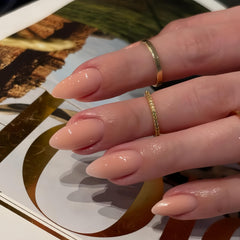 KQueenest front packaging showing nude short almond nails and quick application benefit