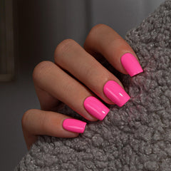 KQueenest front packaging showing hot pink press-on nails and kit benefits