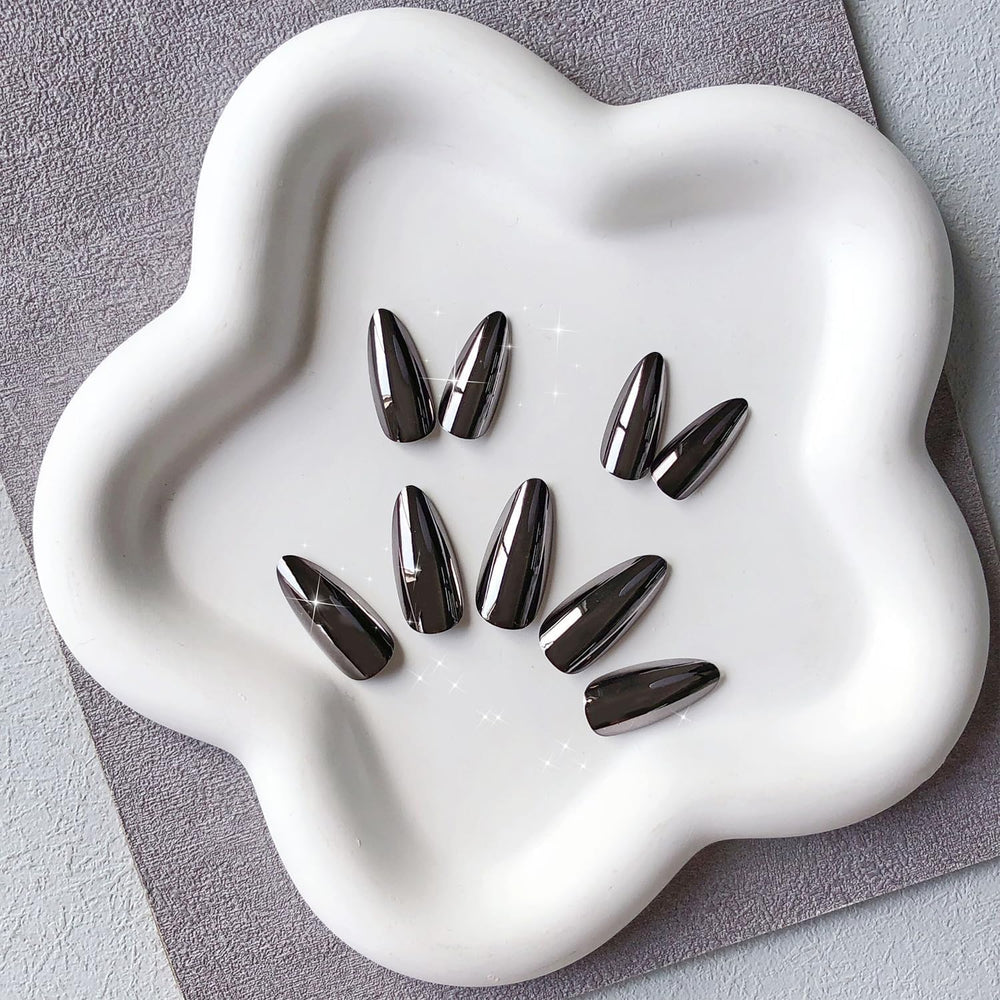 KQueenest nails held in hand showing medium almond scale and comfort