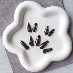 KQueenest nails held in hand showing medium almond scale and comfort