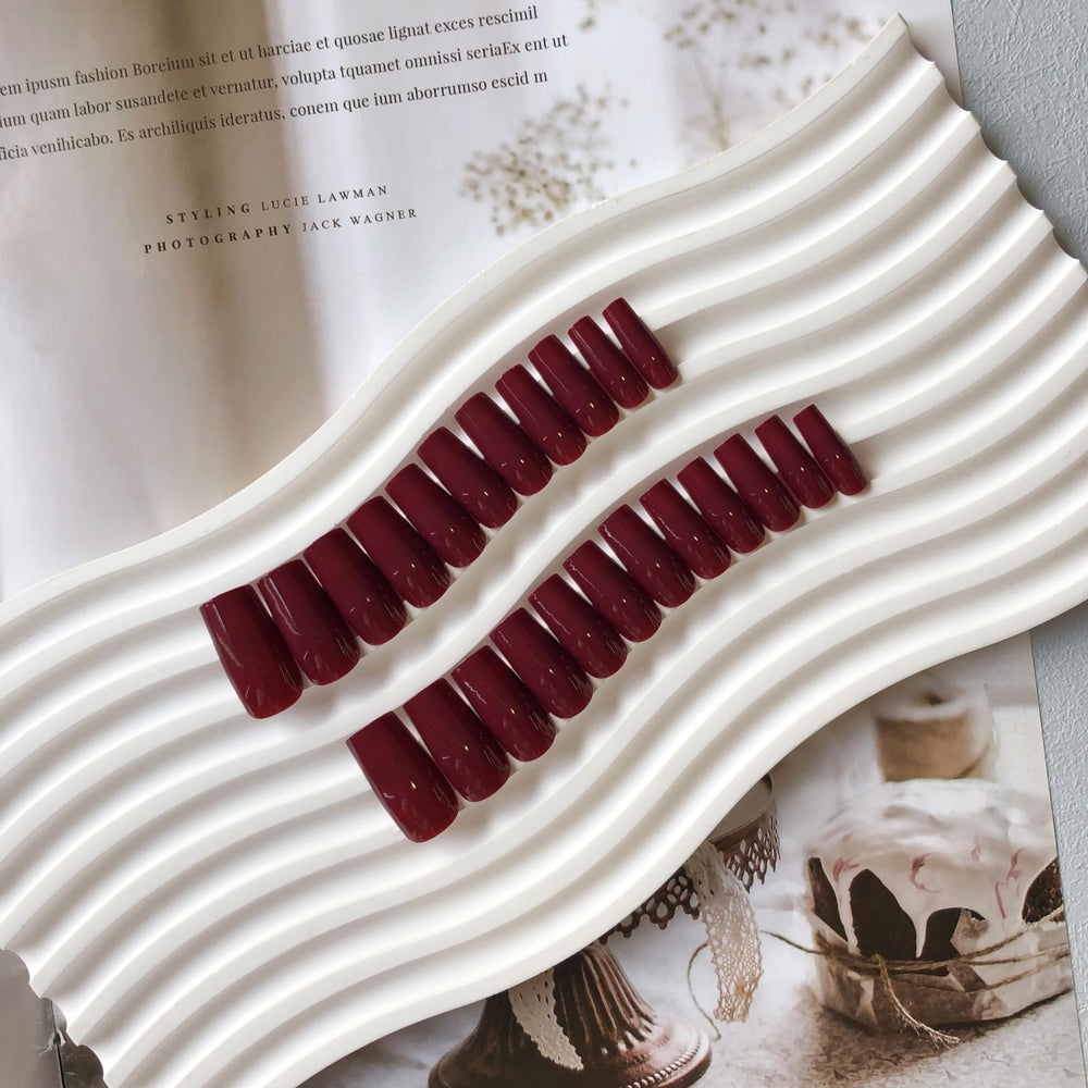 KQueenest medium coffin nails arranged to display tapered tips and elegant style