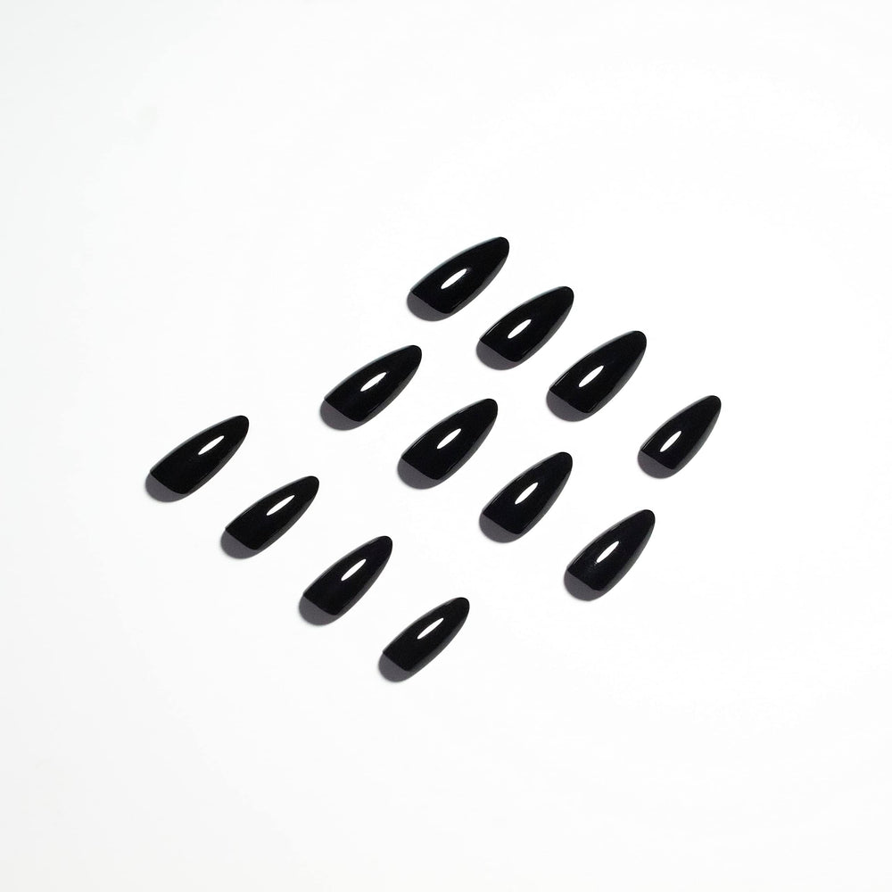 KQueenest nails on hand during application showing quick five-minute manicure benefit