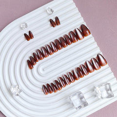 KQueenest side profile of almond stiletto nails demonstrating natural curve