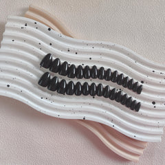 KQueenest side profile showing almond curve for natural fingertip fit and comfort