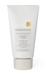 Kristin Ess bottle front view showing label and size, highlights product benefits