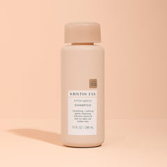 Ingredient label close-up on Kristin Ess shampoo displaying clean formula