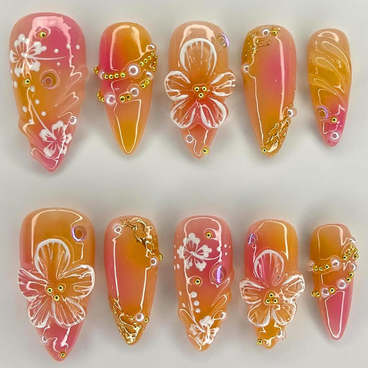 KRTBKR front view showing orange 3D floral press-on nails, quick glam
