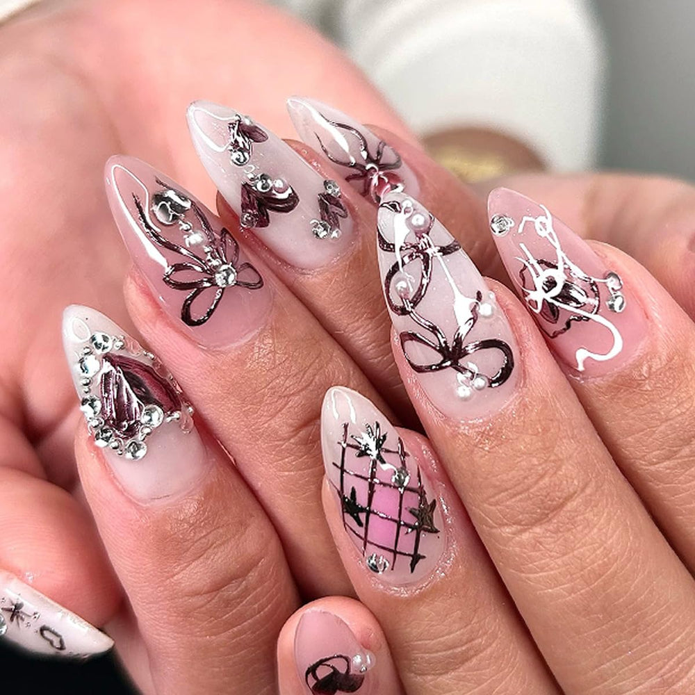 KRTBKR nails in hand for size comparison, illustrates scale and realistic fit benefit
