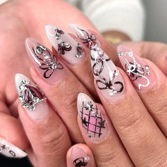 KRTBKR nails in hand for size comparison, illustrates scale and realistic fit benefit