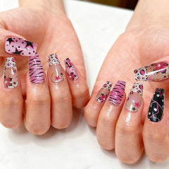 KRTBKR pearl and flower accent macro highlighting decorative nail texture and shine