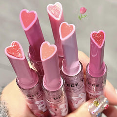 KTouler heart-shaped stick closeup highlighting smooth applicator and charm