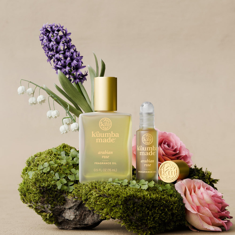 Kuumba Made lifestyle flatlay with rose accents suggesting gift-ready, everyday luxury
