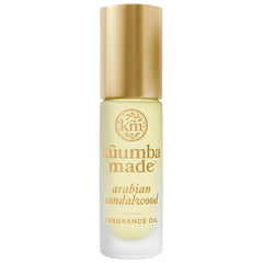 Kuumba Made roller bottle front view showing compact travel size and elegant label benefit: portable fragrance