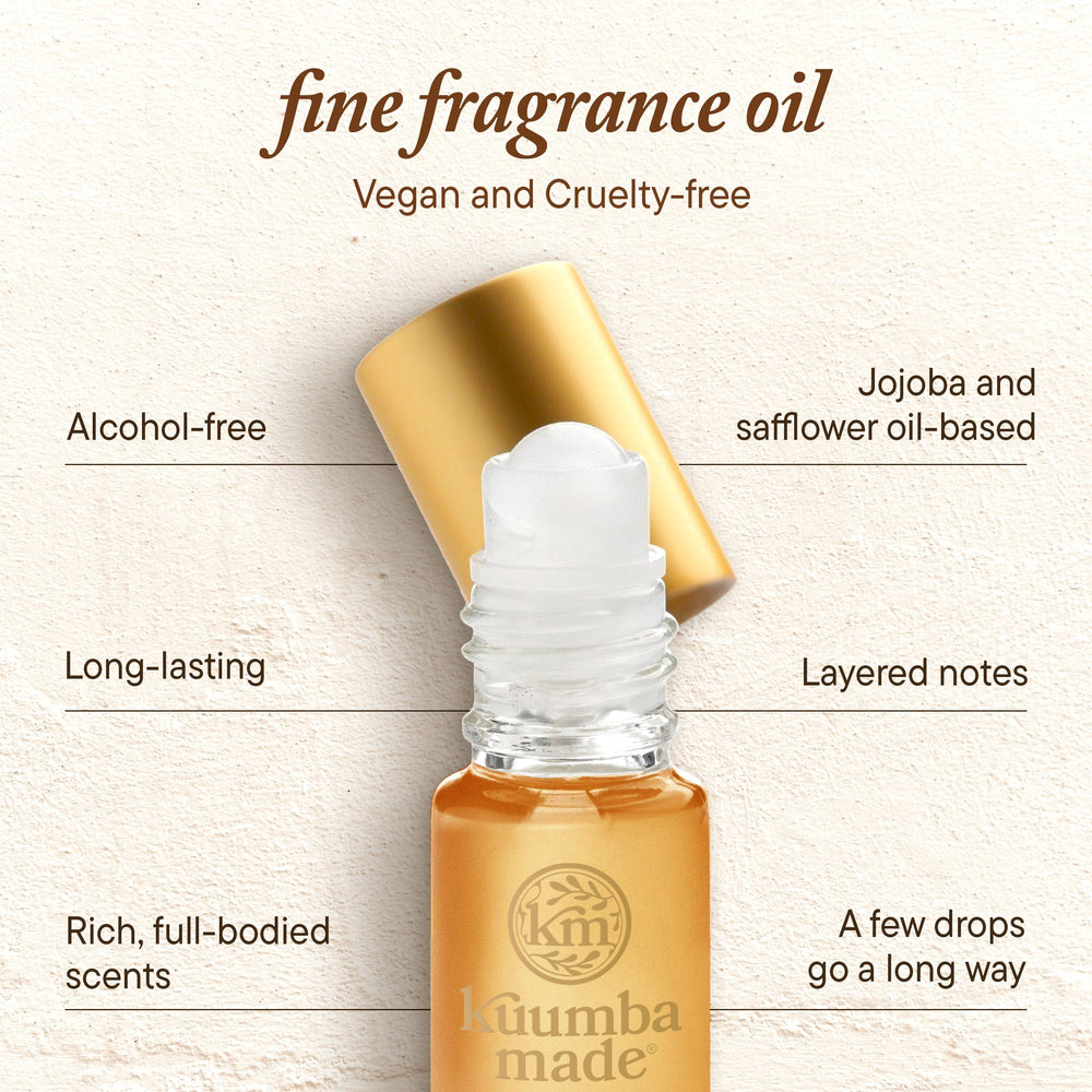 Kuumba Made bottle in hand to show 0.15 fl oz scale and portability benefit