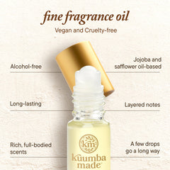 Kuumba Made bottle beside coin showing compact travel size benefit