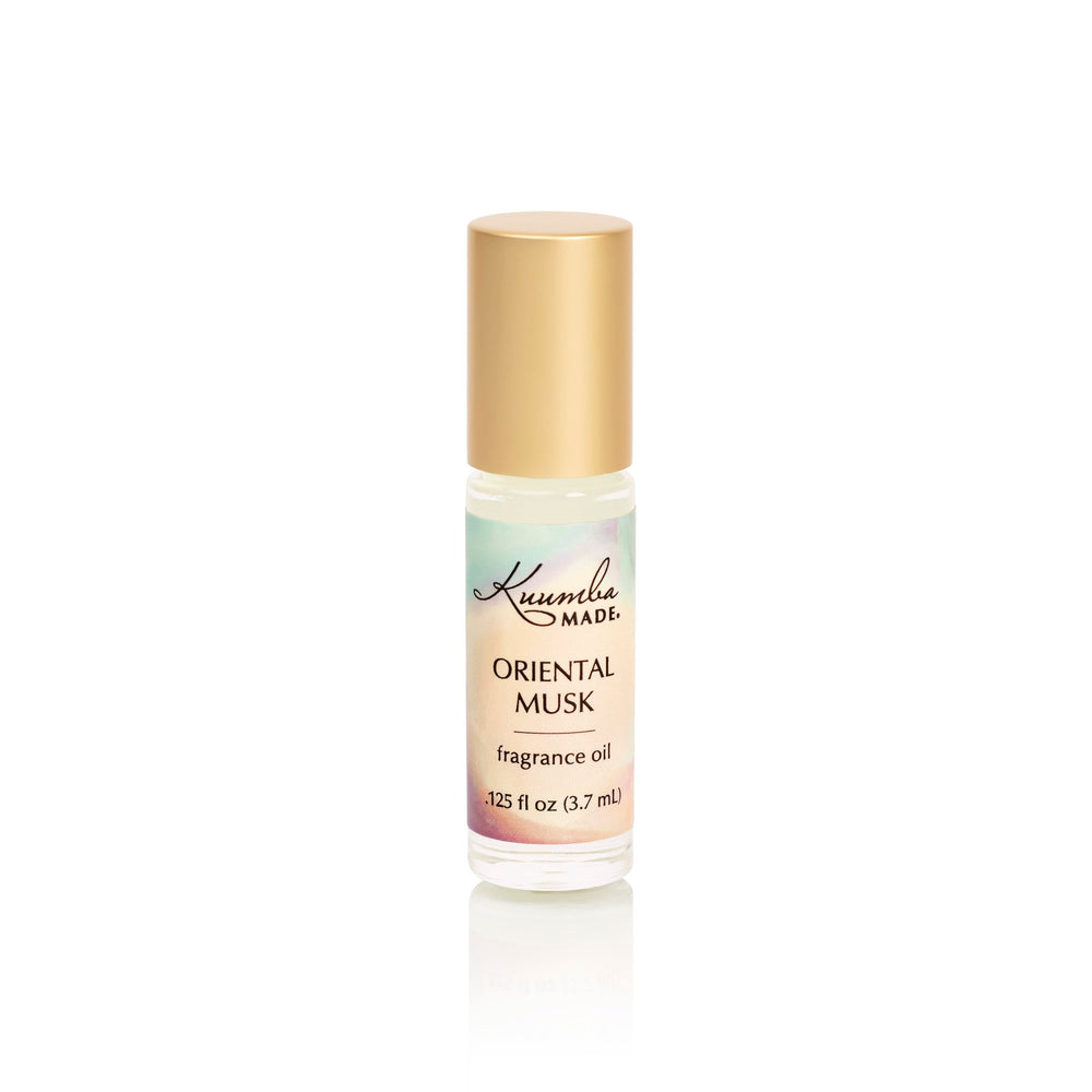 Kuumba Made front bottle shot showing label and compact roller, travel-friendly scent