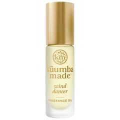 Kuumba Made front view of wind dancer roll-on showing compact bottle and label benefit travel-friendly