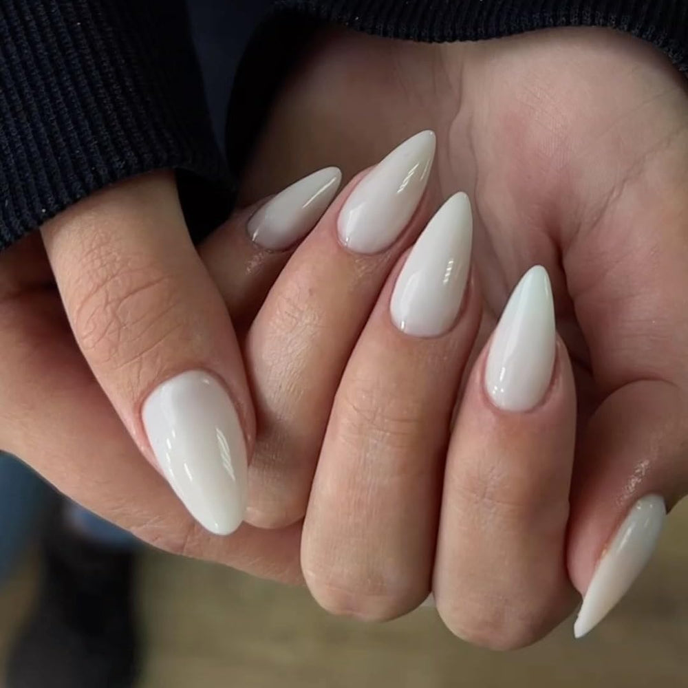 KXAMELIE nails applied on hand showing almond shape and natural fit benefit