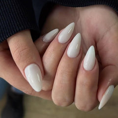 KXAMELIE nails applied on hand showing almond shape and natural fit benefit