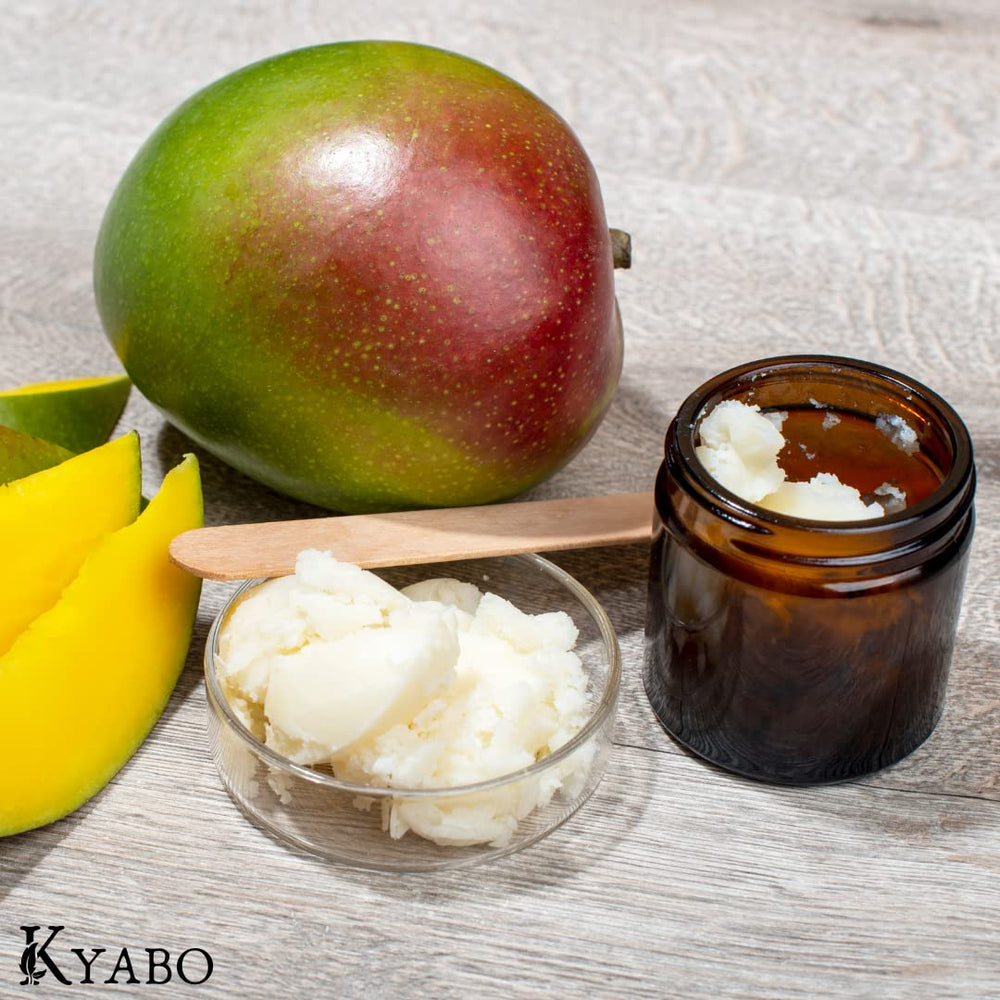 Mixing Kyabo mango butter with oils in bowl for DIY body butter and cosmetic use