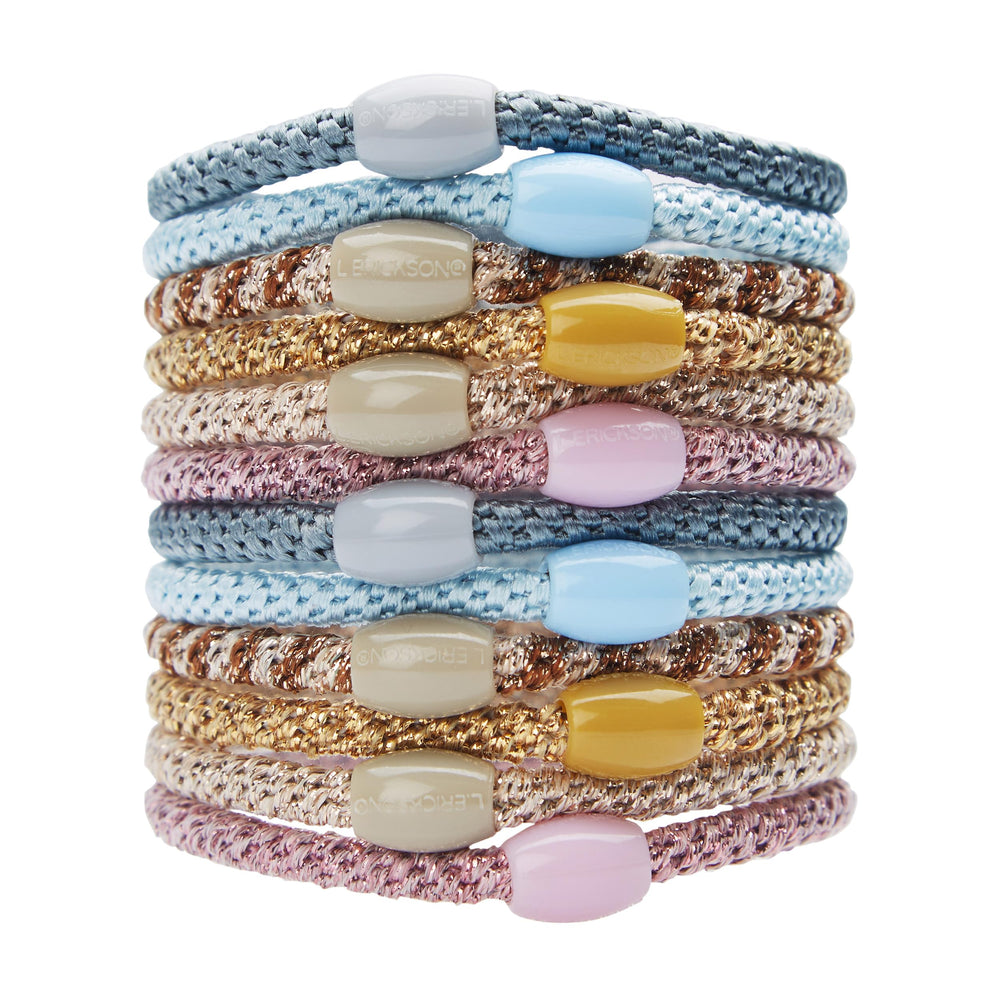L. Erickson front packaging showing pink and blue hair ties and bead accents for quick styling