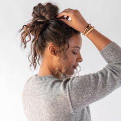L. Erickson lifestyle look with cozy neutrals matching hair ties to outfits