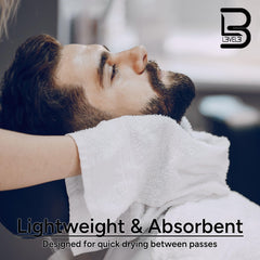 L3 towel in use by barber wiping client hair, showing quick absorbency benefit