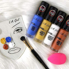 L.A. Girl pigment on a vanity with brushes suggesting everyday use benefit