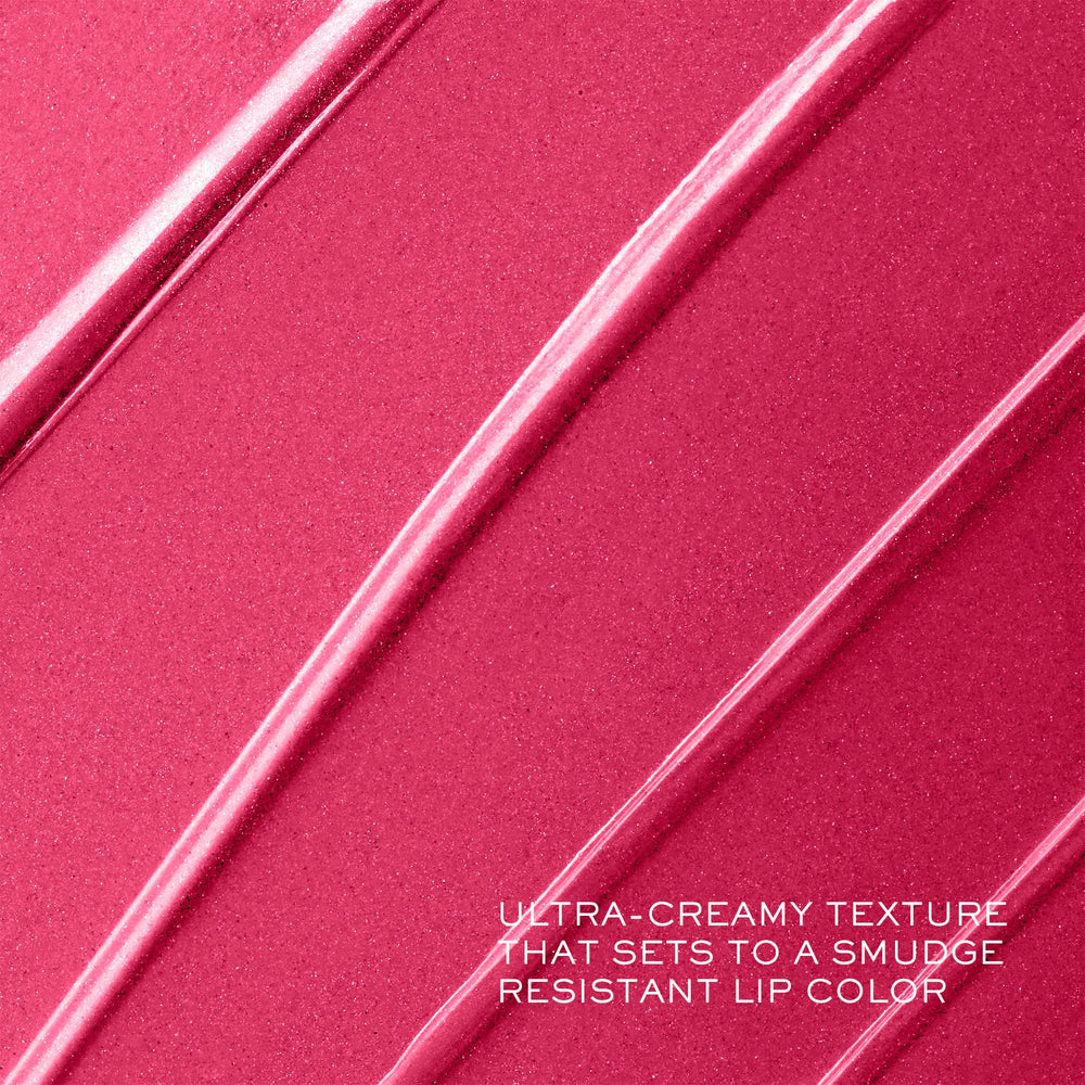 Lancôme lipstick in hand for scale showing compact, travel-ready size