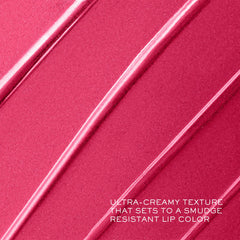 Lancôme lipstick in hand for scale showing compact, travel-ready size