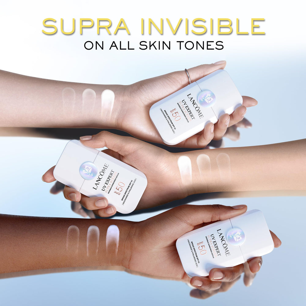 Lancôme size comparison in hand indicating portable everyday sunscreen travel-friendly