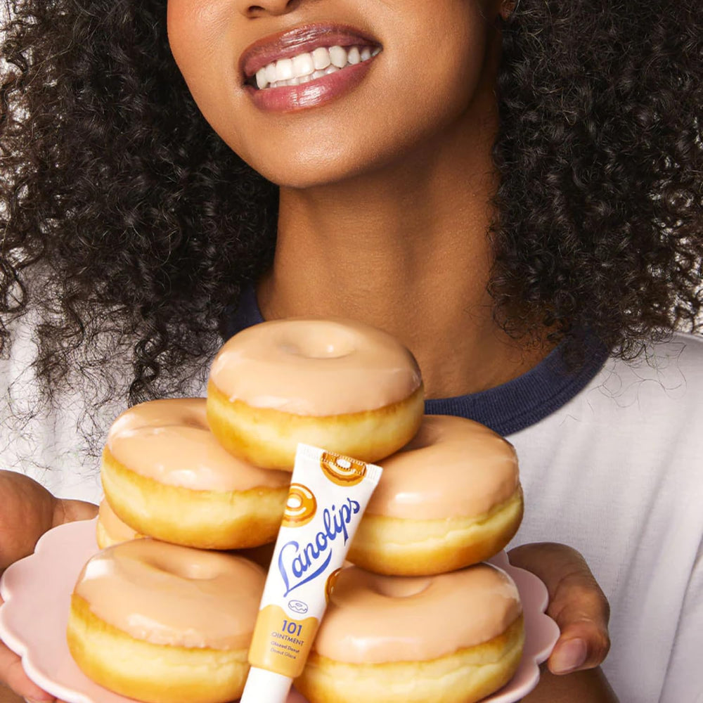 Lanolips glazed donut tin in a purse lifestyle shot conveying daily convenience
