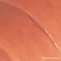LAURA GELLER New York gloss beside coin for size comparison and portability
