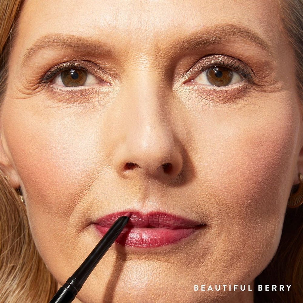 LAURA GELLER NEW YORK lip swatch on arm showing rich Beautiful Berry payoff benefit