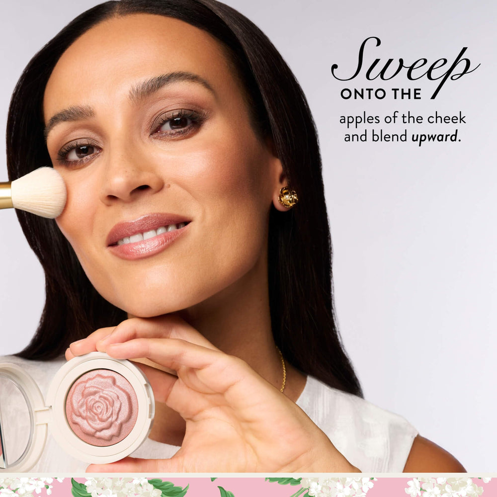 LAURA GELLER NEW YORK compact next to coin for scale and portability benefit