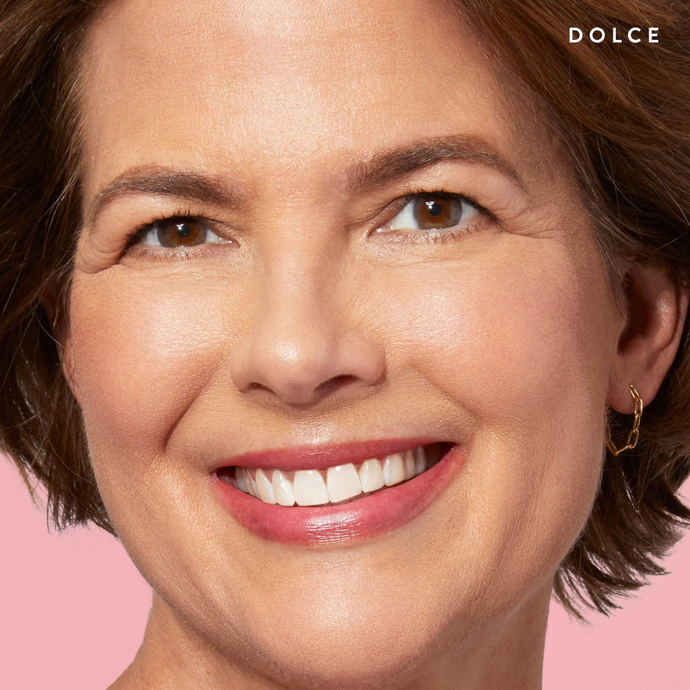 LAURA GELLER NEW YORK arm swatch of Dolce showing sheer coral payoff and blendability