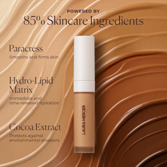 Laura Mercier concealer in a bathroom scene during morning routine showing long-wear benefit