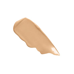 Laura Mercier next to hand for size comparison showing compact tube benefit: travel-friendly