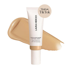 Laura Mercier cream texture swirl highlighting dewy, hydrating feel