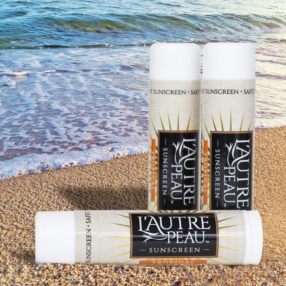 L'AUTRE PEAU stick in hand applying to face demonstrating quick reapplication benefit