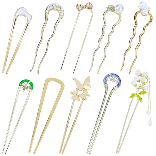 Lawie gold pack front view showing ten decorative hair forks and charms
