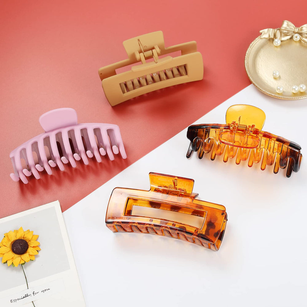 Hand holding LAXIZAR clips to show scale and portability for everyday use