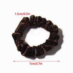 LFOUVRE scrunchie worn on wrist as accessory and quick on-the-go hair solution