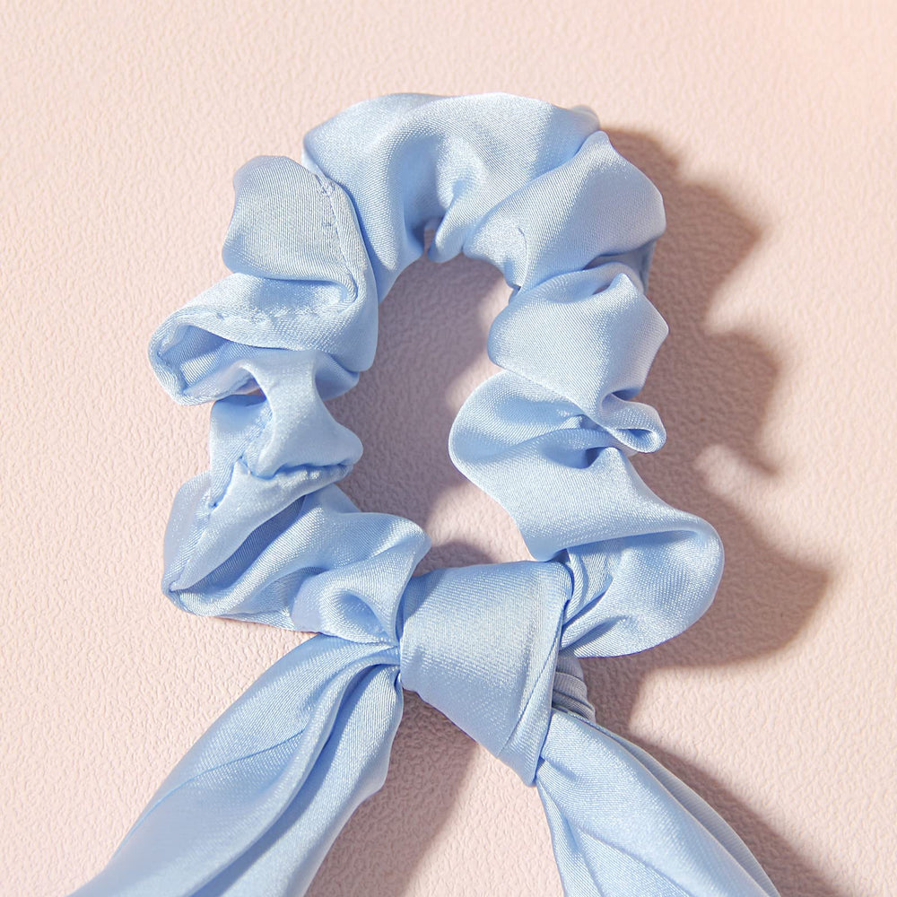 LFOUVRE lifestyle image with model wearing blue scrunchie for styled look
