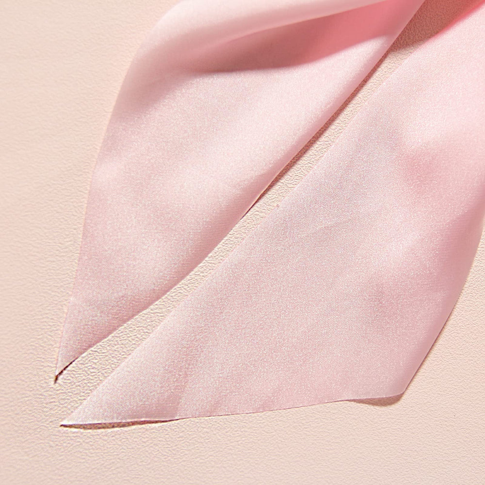 LFOUVRE scrunchie held in hand showing scale and comfortable elasticity